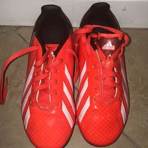 Adidas Traxion red soccer shoes